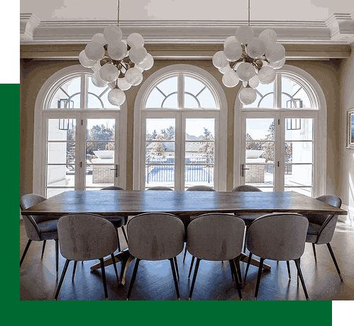 Arched picture windows in elegant dining room with outdoor view